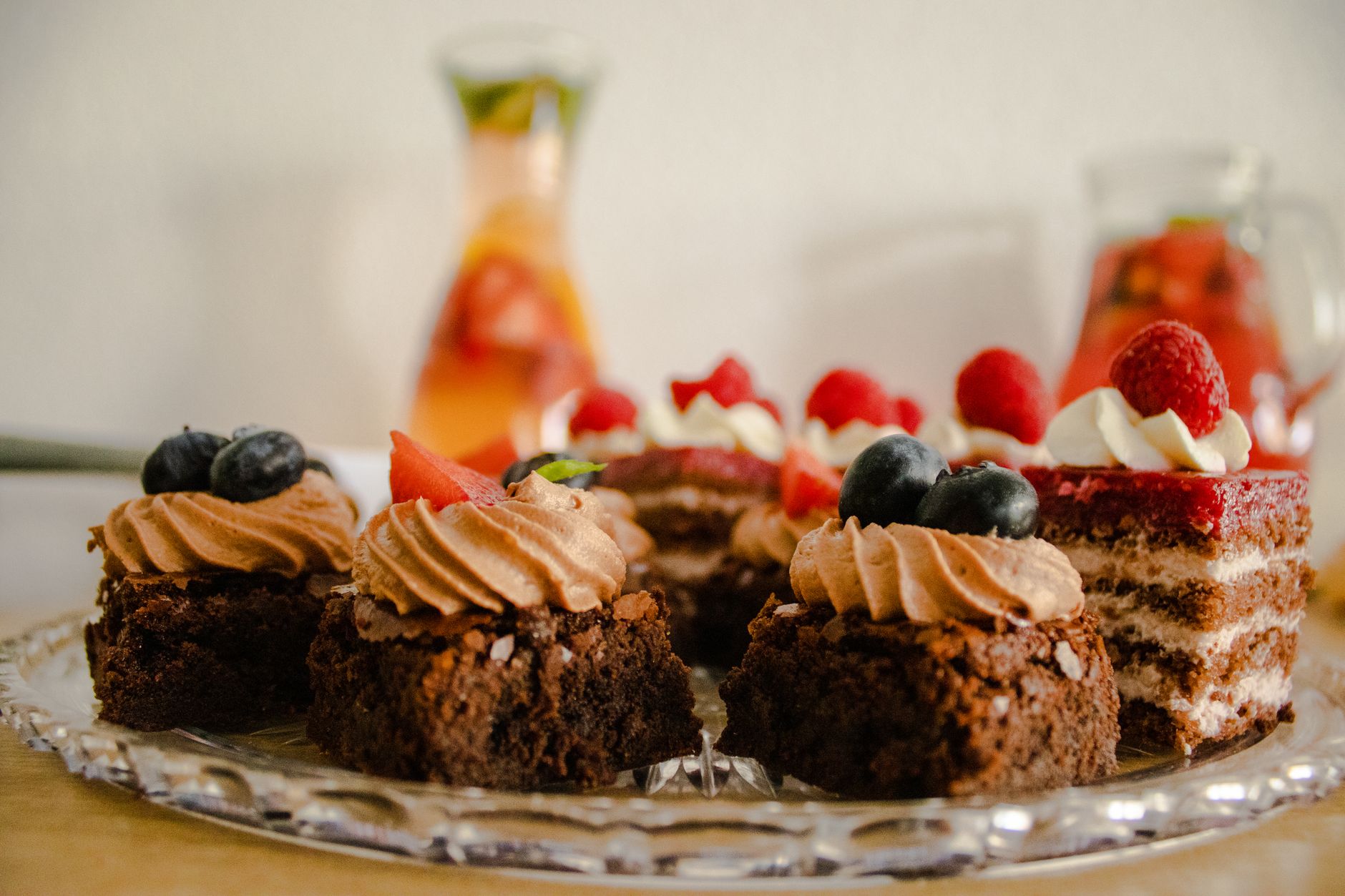 slices of chocolate cakes with fruit toppings