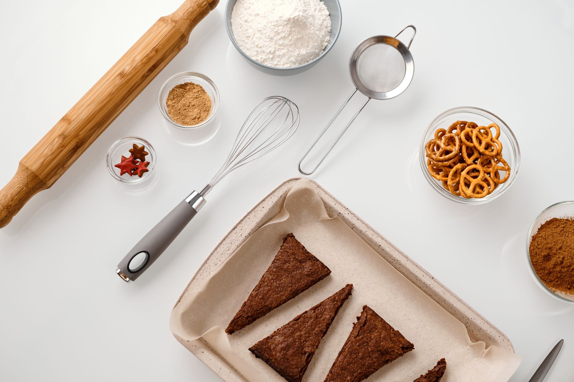 top view of baking tools and cookies on a tray